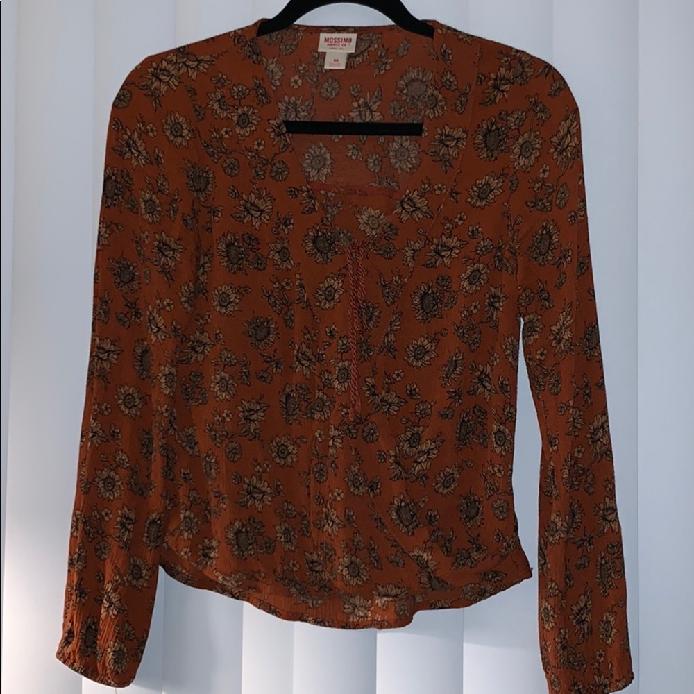 Fun dark orange shirt. Ties in the middle